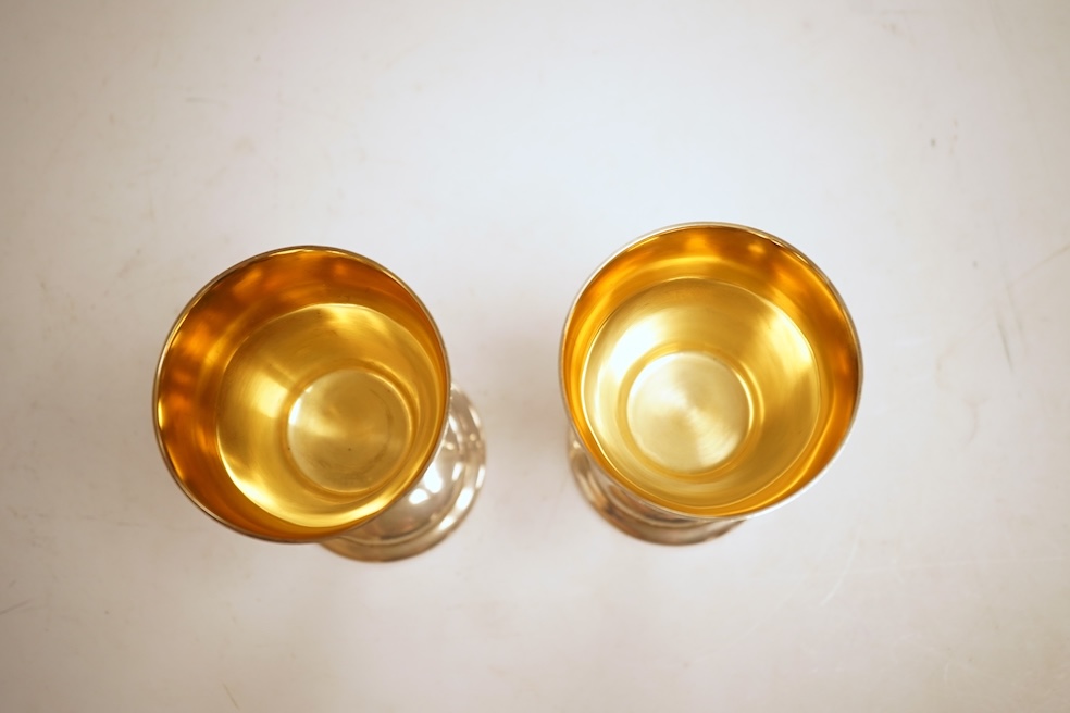 A pair of modern silver Lincoln Cathedral commemorative chalices, no.75 & 76, by John Cussell, London, 1977, 14.7cm, 13oz.